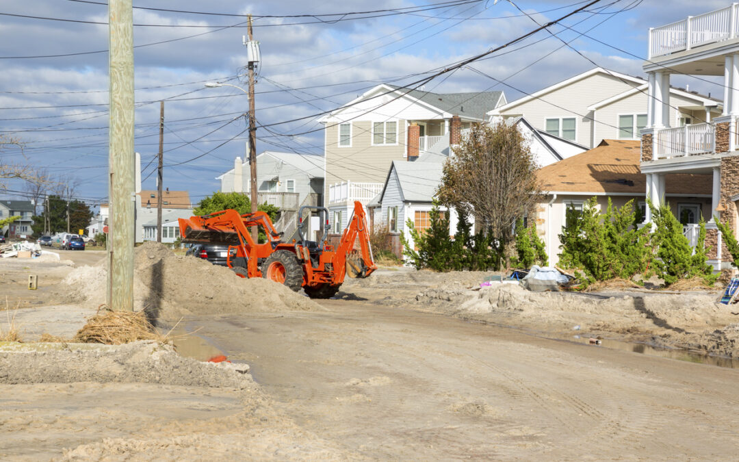 a construction vehicle in a dirt area - Funding Strategies for Disaster Recovery