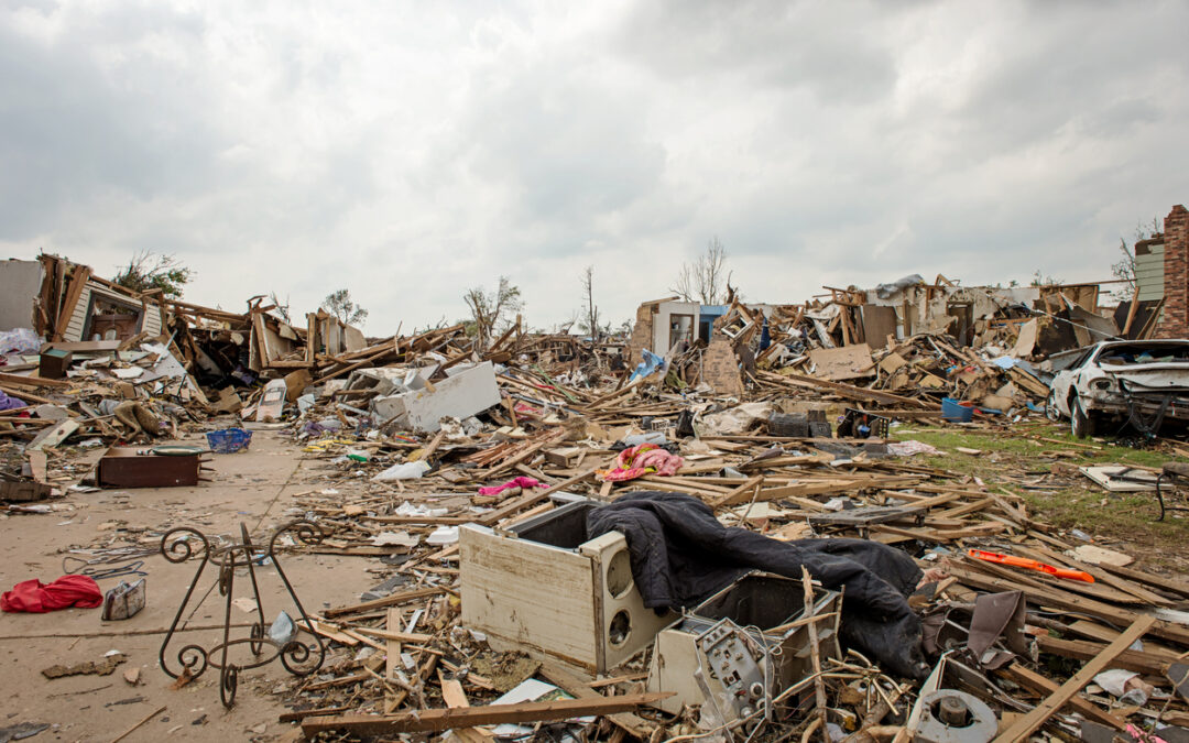 a large pile of debris and debris - Post-Hurricane Cleanup